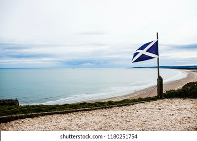 Flag Of Scotland On The Sea Background. St Cyrus Beach, Angus, Aberdeenshire, Scotland, UK