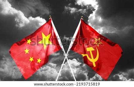 The flag of the Soviet Union and China hangs on the cloudy sky. waving in the sky