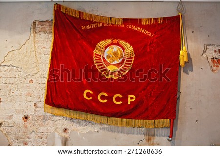 Flag of Soviet Union hanging on the shabby wall