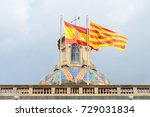 Flag of Spain and Flag of Catalonia at the top of Palau de la Generalitat de Catalunya, the Old City (Ciutat Vella) of Barcelona, Catalonia, Spain.