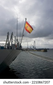 Flag Of Spain On A Ship Of The Spanish Navy Moored In The Port Of The Military Arsenal Of Ferrol On A Cloudy Day