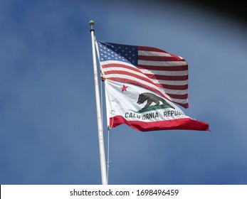 Flag Of The State Of California Flying From A Pole, Cropped Shot. 