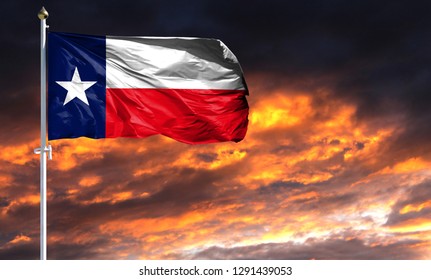 Flag State Of Texas On Flagpole Fluttering In The Wind Against A Colorful Sunset Sky