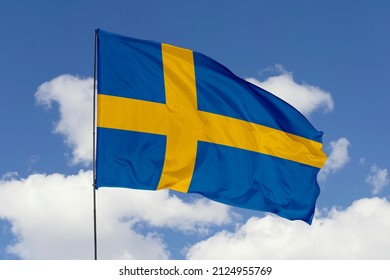 flag of Sweden. Sweden's national symbols. Swedish's flag isolated on a sky background.