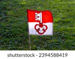 Flag of Swiss canton of Obwalden blowing in the wind at meadow on a sunny autumn afternoon. Photo taken November 29th, 2023, Zurich, Switzerland.