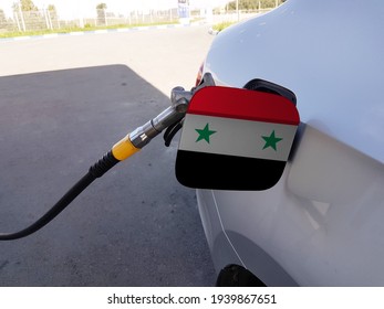 Flag Of Syria On The Car's Fuel Tank Filler Flap. Petrol Station. Fueling Car At A Gas Station.