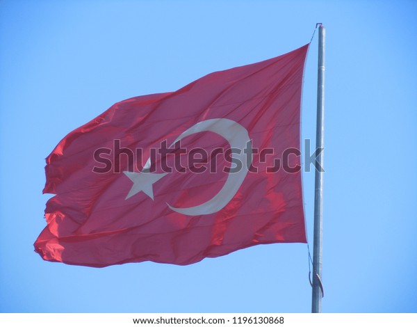 flag-turkey-against-blue-sky-600w-1196130868.jpg