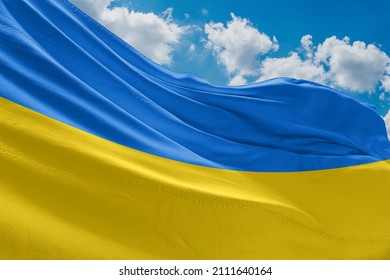 The flag of Ukraine is a banner of two equally sized horizontal bands of blue and yellow 