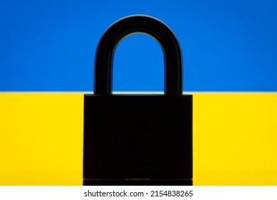 Flag of Ukraine with black lock in the foreground. Closed country, restrictions concept