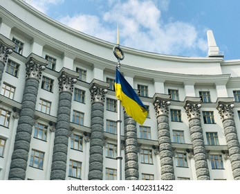 The flag of Ukraine near The Cabinet of Ministers of Ukraine on Mykhaila Hrushevskoho street in Kyiv - Shutterstock ID 1402311422