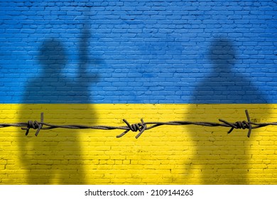 Flag of Ukraine painted on a brick wall with soldiers shadows. Relationship between Ukraine and Russia