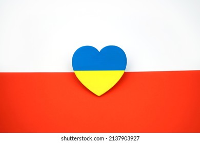 Flag Of Ukraine In Shape Of Heart On Background Of Flag Of Poland. Symbol Of Solidarity And Support. Brotherly Love                