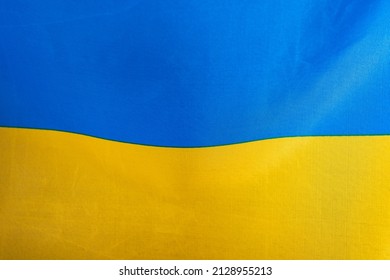 Flag of Ukraine, UA. Blue and yellow colors. Close up shot, background - Shutterstock ID 2128955213
