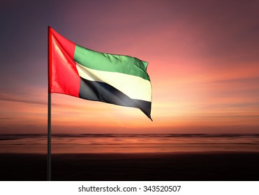 Flag Of United Arab Emirates Flying Against Beautiful Morning Sky. UAE Celebrates National Day On December 2.