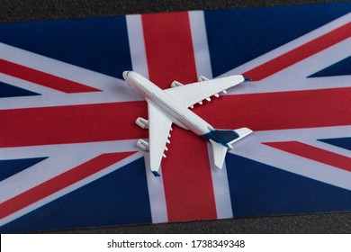 Flag Of United Kingdom And Toy Airplane. Air Travel In UK. Resuming Flights After Quarantine.