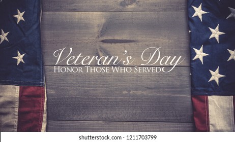 The Flag Of The United Sates Of America On A Grey Plank Background With Veterans Day Greeting