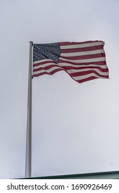 Flag Of The United States, American Flag Or U.S. Flag Waving Against A Cloudy Sky