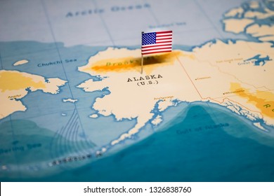 the Flag of United States on the alaska in the world map