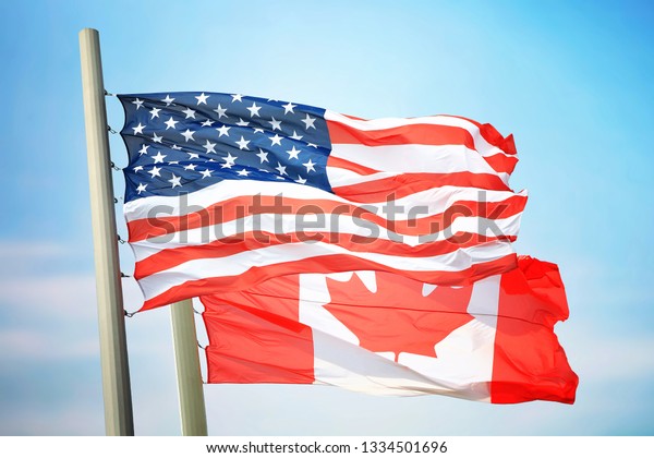 Flag Usa Canada Against Background Blue Stock Photo (Edit Now) 1334501696