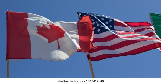 Flag of the USA and Canada in the wind