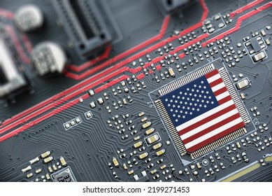 Flag of USA on a processor, CPU Central processing Unit or GPU microchip on a motherboard. US firms have become the latest collateral damage in US-China tech war. US blocks sales of AI chips to China. - Shutterstock ID 2199271453