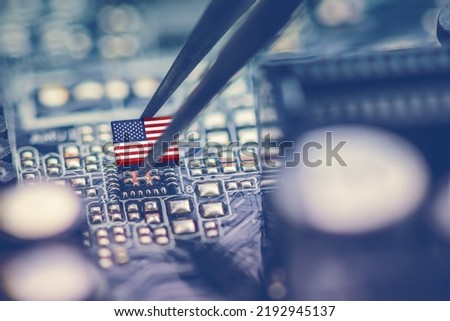 Flag of USA on a processor, CPU Central processing Unit or GPU microchip on a motherboard. Congress passes the CHIPS Act of 2022 to strengthen domestic semiconductor manufacturing, research and design