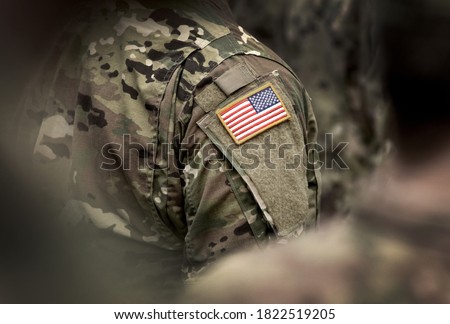 Flag of USA on soldiers arm. Veterans Day. The United States Armed Forces. Military forces of the United States of America. Remembrance Day. Memorial day.