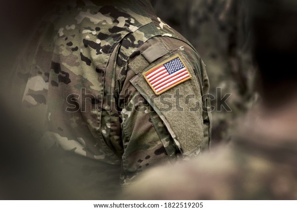 Flag of USA on soldiers\
arm. Veterans Day. The United States Armed Forces. Military forces\
of the United States of America. Remembrance Day. Memorial\
day.