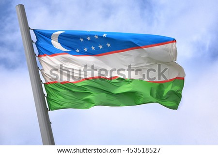 Flag of Uzbekistan against the sky