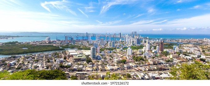 Flag Wavering In Front Of Scenic View Of Cartagena Modern Skyline Near Historic City Center And Resort Hotel Zone.