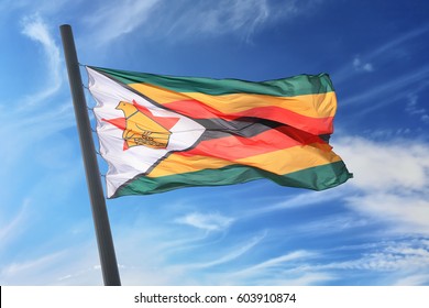 Flag of Zimbabwe against the background of the blue sky