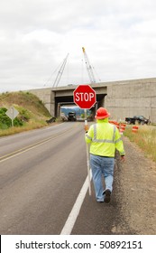 Flagger Controlling The Traffic During The Rebuilding Of The Shady Bridge Of Interstate 5 Crossing The South Umpqua River Just South Of Roseburg Oregon