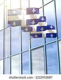 Flagpoles with the flag of Quebec in front of the business center - Shutterstock ID 2222953087