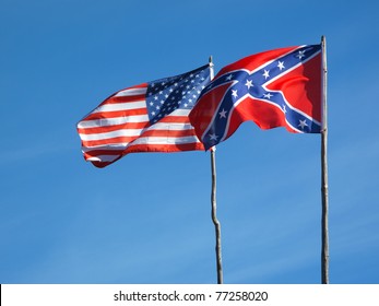 Flags Of American Civil War. Union Flag And Confederate Flag Under Blue Sky.