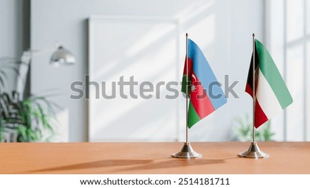 FLAGS OF AZERBAIJAN AND KUWAIT ON TABLE