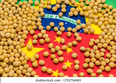 Flags Of China And Brazil Covered In Soybeans. Concept Of Chinese And South America Agricultural Imports, Exports, Trade, Trade War, Tariffs, Production And Commodity Markets