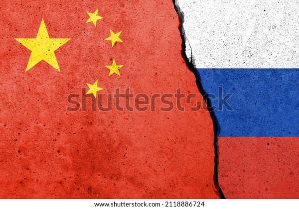 Flags of\
China and Russia painted on the concrete\
wall