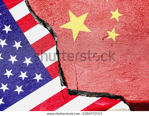 Flags of China and the United States of\
America on a cement plaster of a cracked\
wall