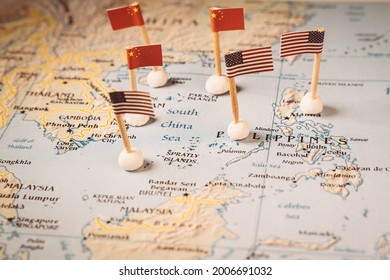 flags of china and the united states on a map of the south china sea. Concept of the south china sea diplomatic conflict