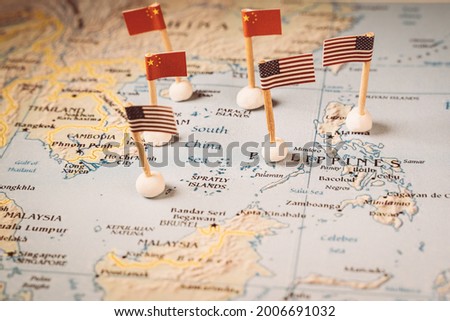 flags of china and the united states on a map of the south china sea. Concept of the south china sea diplomatic conflict