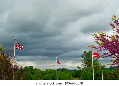 Flags with cloudy sky background