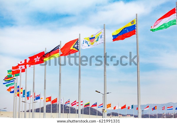 Flags\
of countries. different countries on the\
flagpole