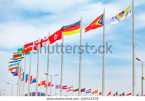 Flags\
of countries. different countries on the\
flagpole