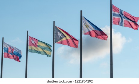Flags of different nation floating in the wind