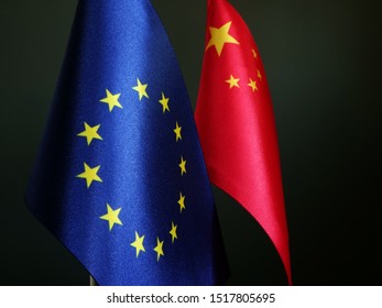 Flags Of EU And China On Desk.