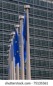 Flags Of The European Union Are Hanging Besides The Headquarters Of The European Commission In Brussels, Belgium.