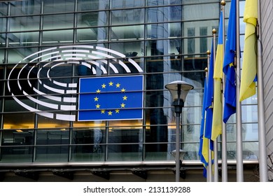 Flags Of European Union And Ukraine Flutter Outside EU Parliament Building, In Brussels, Belgium On March 1st, 2022.