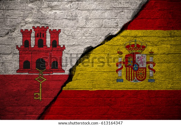 Flags of Gibralar and Spain on a wall texture. \
There has been a long standing claim by Spain that Gibraltar should\
be part of the Kingdom of Spain rather than a British Overseas\
Territory