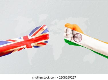 Flags Of India And United Kingdom Or UK On Hands Punch To Each Others On Light Gray World Map Background, UK Vs India In Trade Conflict War Concept