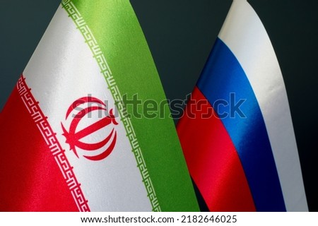 Flags of Iran and Russia as a symbol of diplomatic relations.